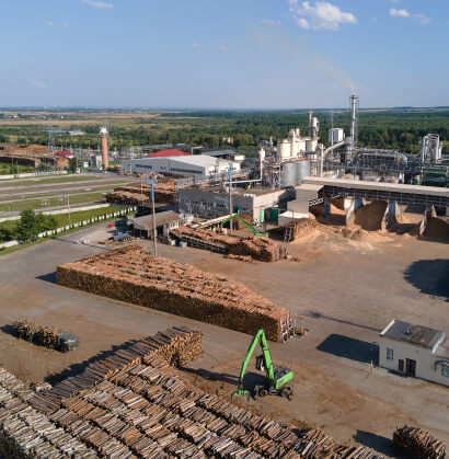aerial-view-of-wood-processing-factory-with-stacks-of-lumber-at-plant-manufacturing-yard 1